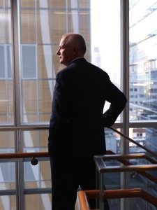 Dean Robert A. Harrington, M.D., gazing out a window from the Belfer Research Building.