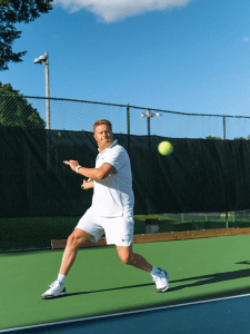Heart transplant recipient Mati Luik playing tennis.