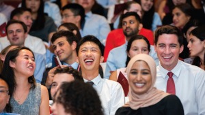 Members of the Weill Cornell Medicine Class of 2027 smiling at their White Coat Ceremony