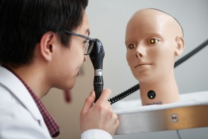 Student practices an eye examination.