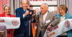 Lee Feil, Jeffrey Feil, Sanford I. Weill and Joan Weill cut a ceremonial ribbon